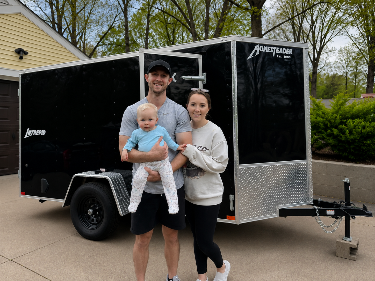 Trevor Kurtz and his family beside the Kurtz Details trailer